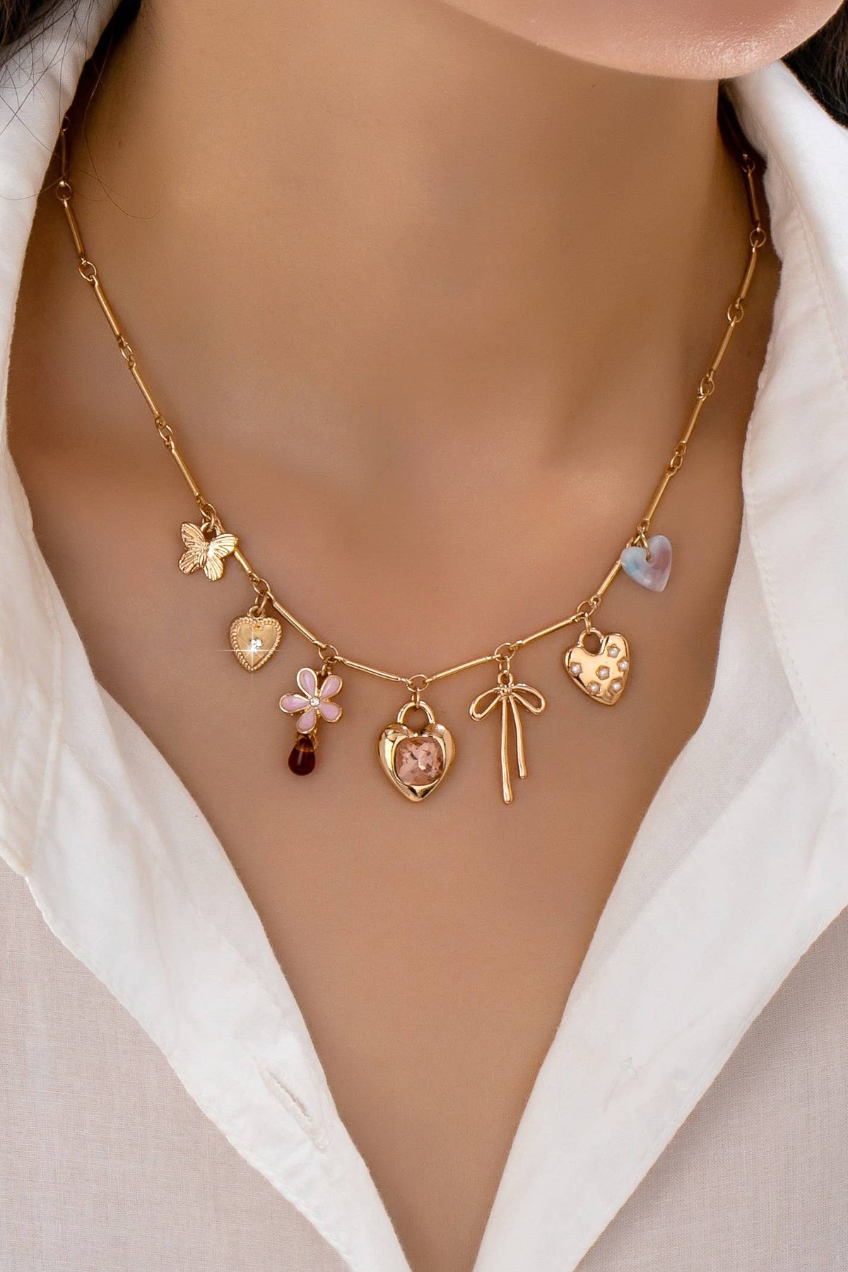 CHARM NECKLACE-HEARTS FLOWER BOW BUTTERFLY | 80N92639 GOLD GOLD JOSSLYN by wall to wall- Tilden Co.
