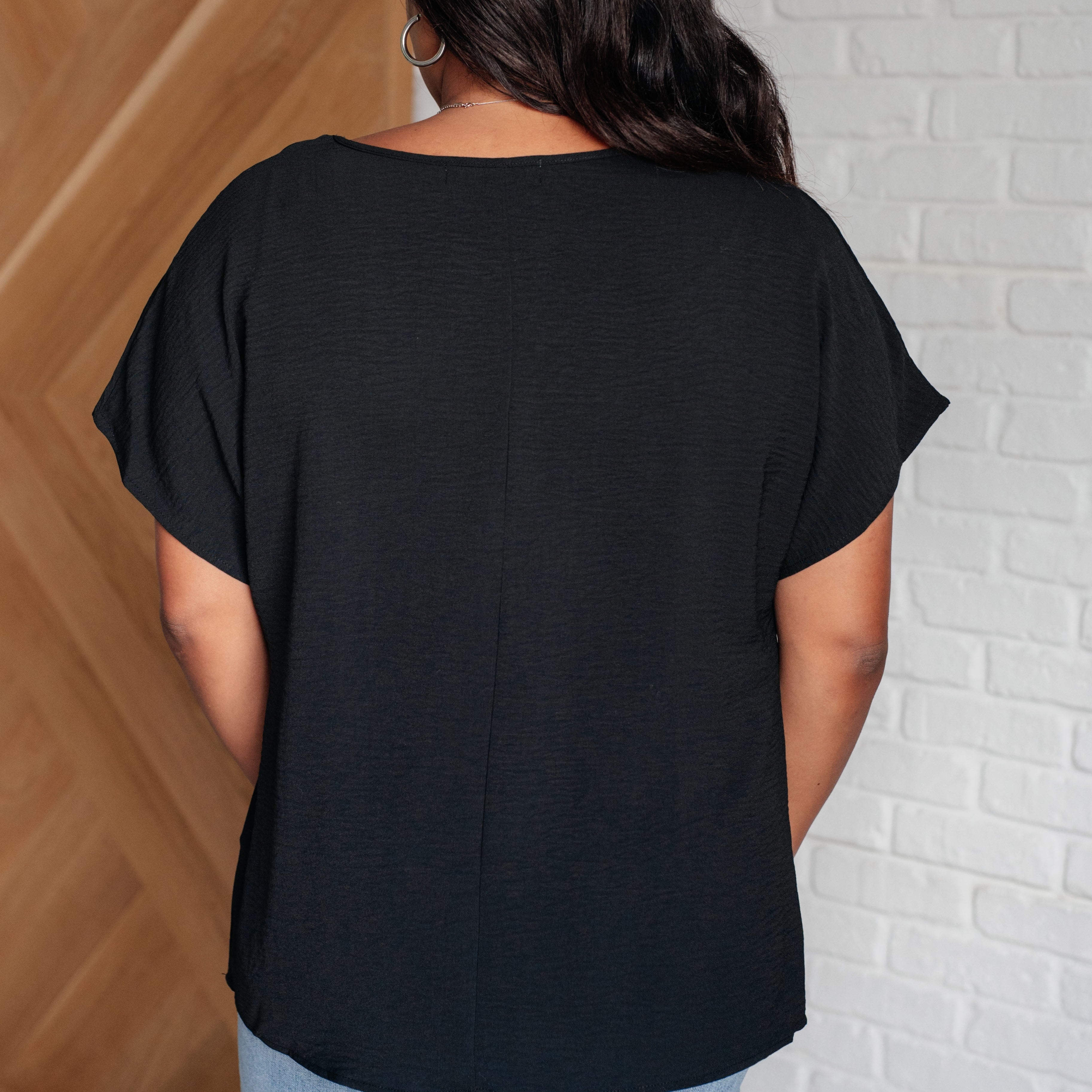 Frequently Asked Questions V-Neck Top in Black Tops Ave Shops- Tilden Co.