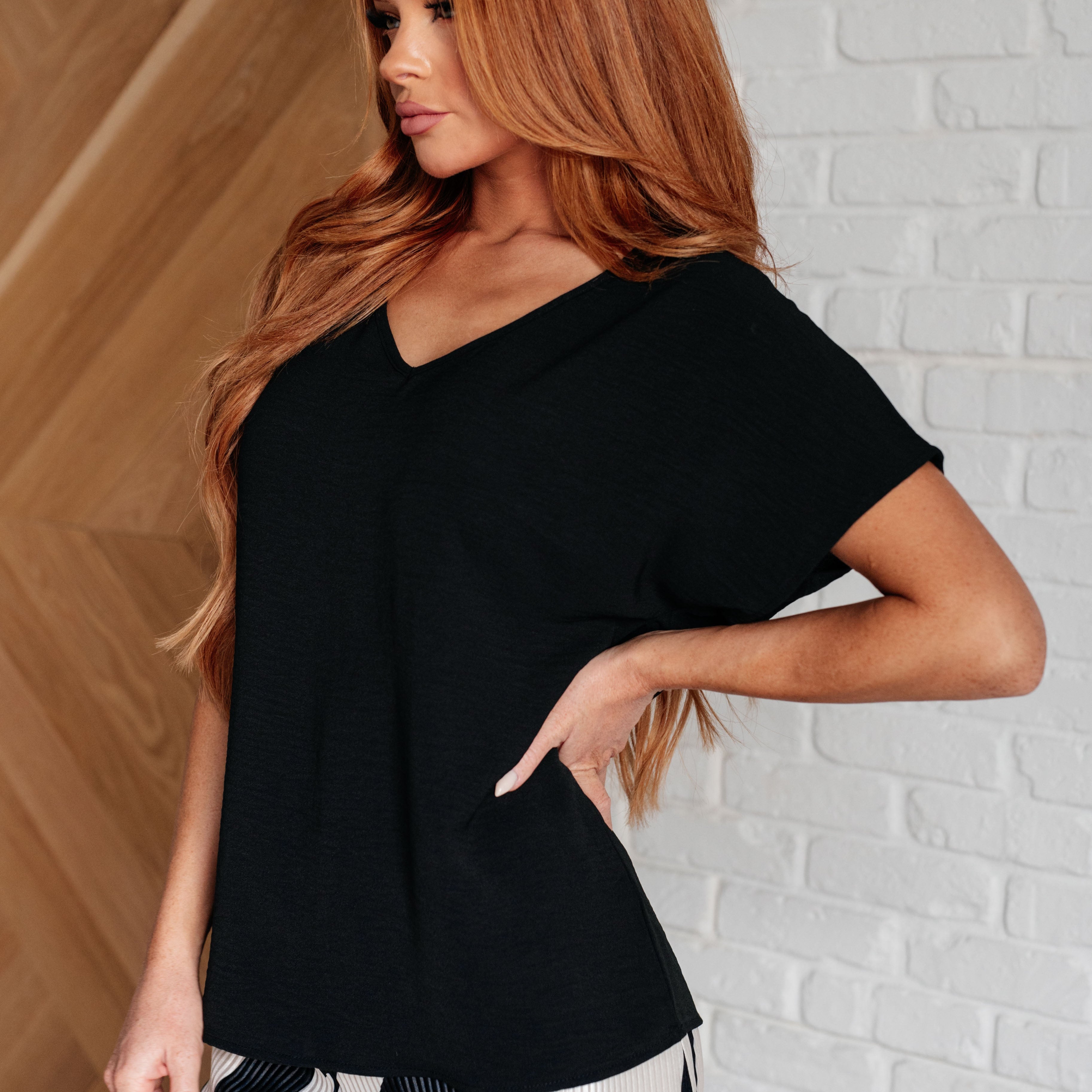 Frequently Asked Questions V-Neck Top in Black Tops Ave Shops- Tilden Co.