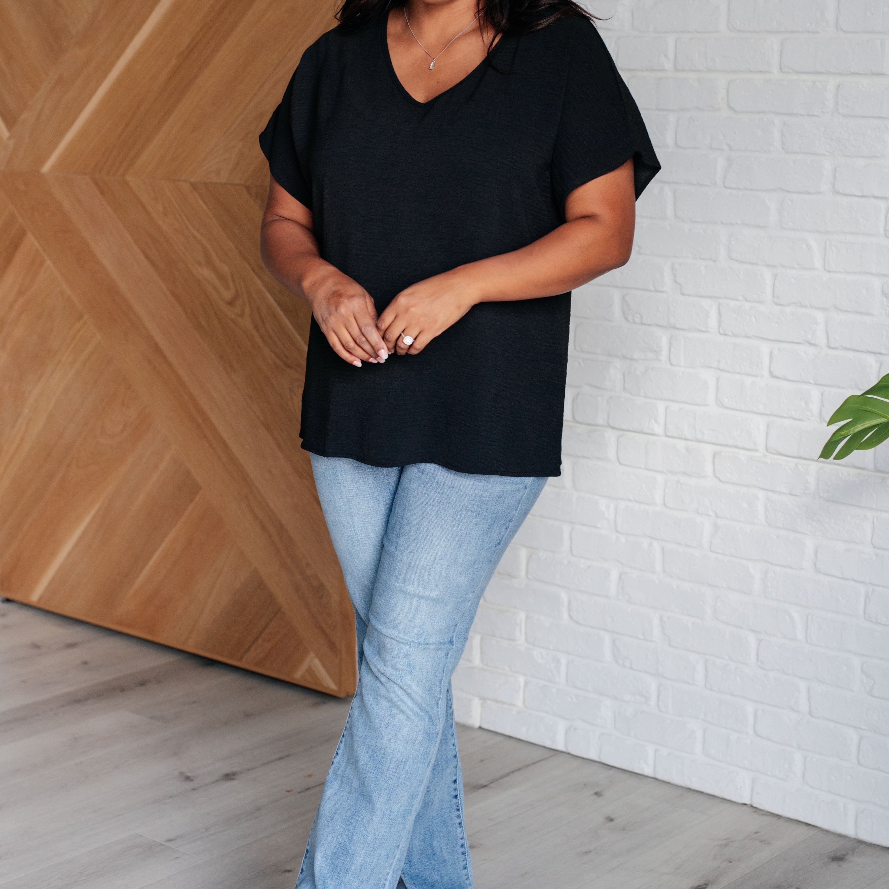 Frequently Asked Questions V-Neck Top in Black Tops Ave Shops- Tilden Co.