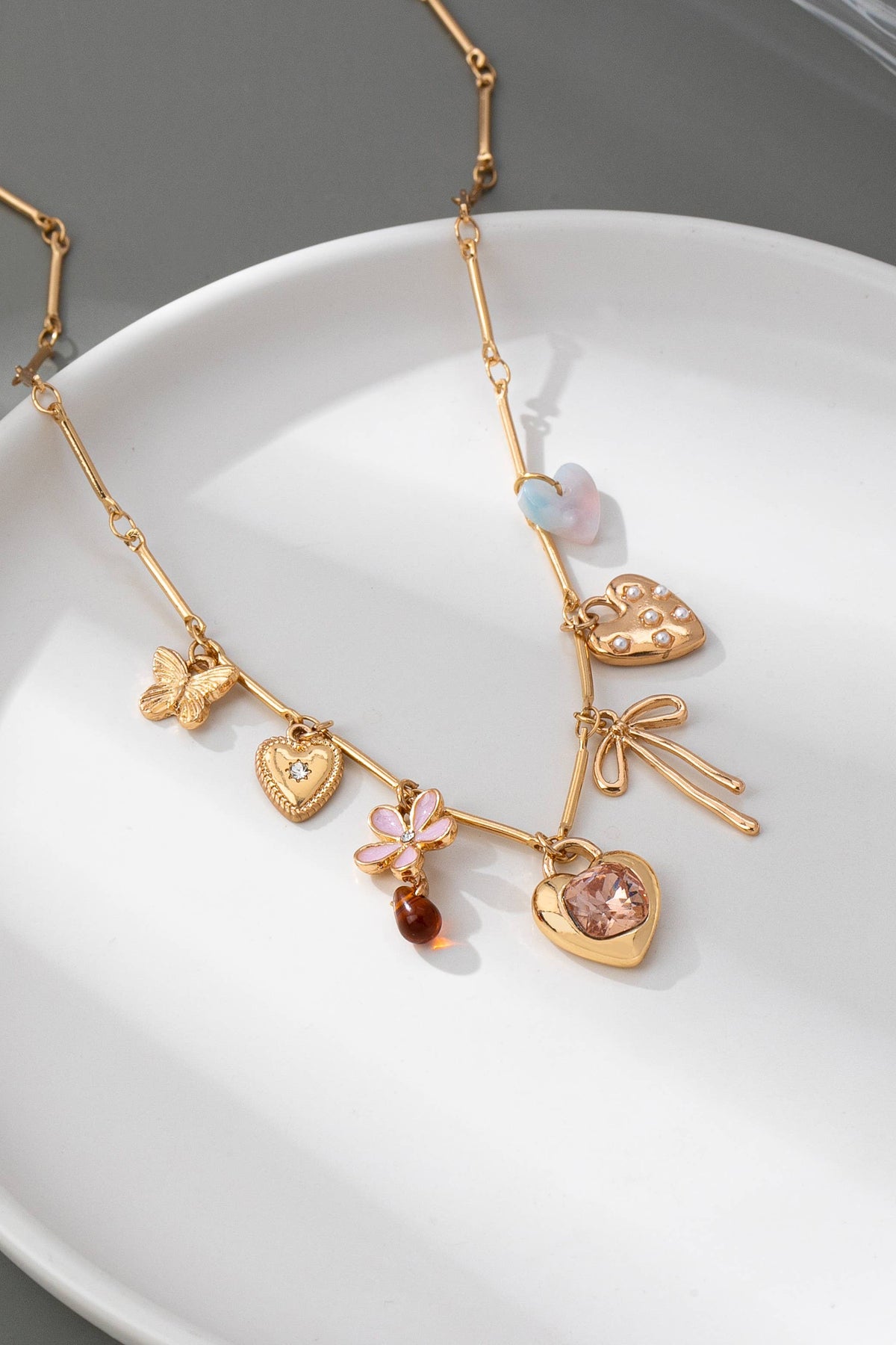 CHARM NECKLACE-HEARTS FLOWER BOW BUTTERFLY | 80N92639 JOSSLYN by wall to wall- Tilden Co.