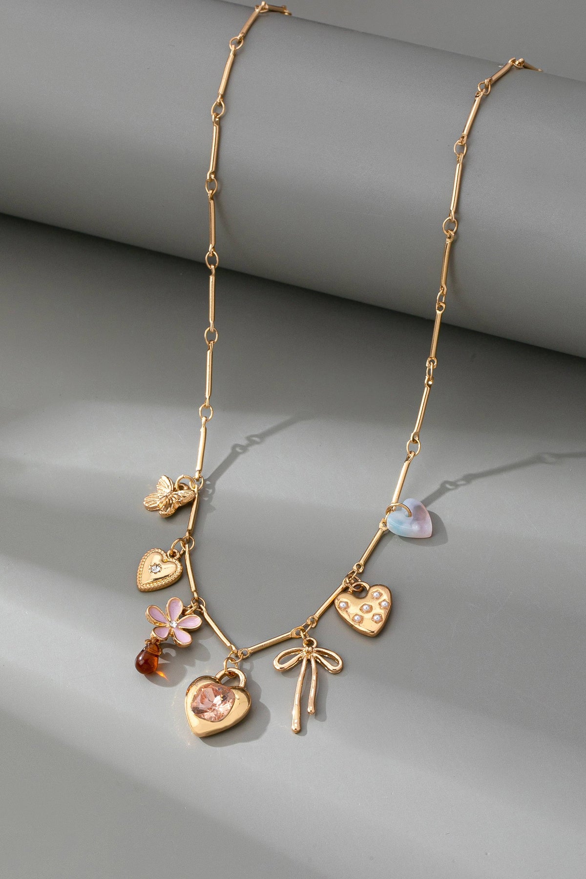 CHARM NECKLACE-HEARTS FLOWER BOW BUTTERFLY | 80N92639 JOSSLYN by wall to wall- Tilden Co.