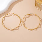 Oversized Hammered Wavy Hoop Earrings | 80E61830 JOSSLYN by wall to wall- Tilden Co.