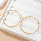 Oversized Hammered Wavy Hoop Earrings | 80E61830 JOSSLYN by wall to wall- Tilden Co.