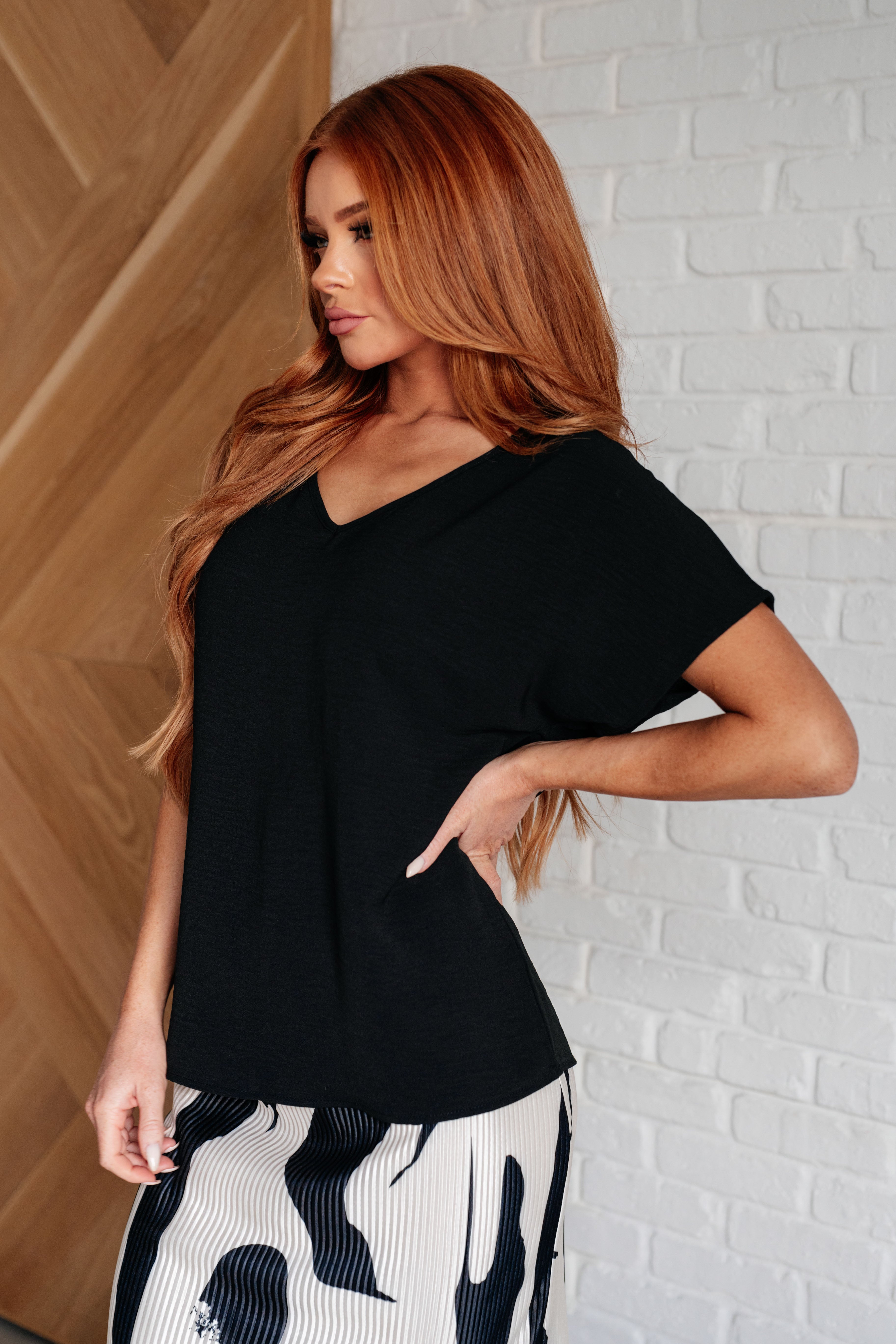 Frequently Asked Questions V-Neck Top in Black Tops Ave Shops- Tilden Co.