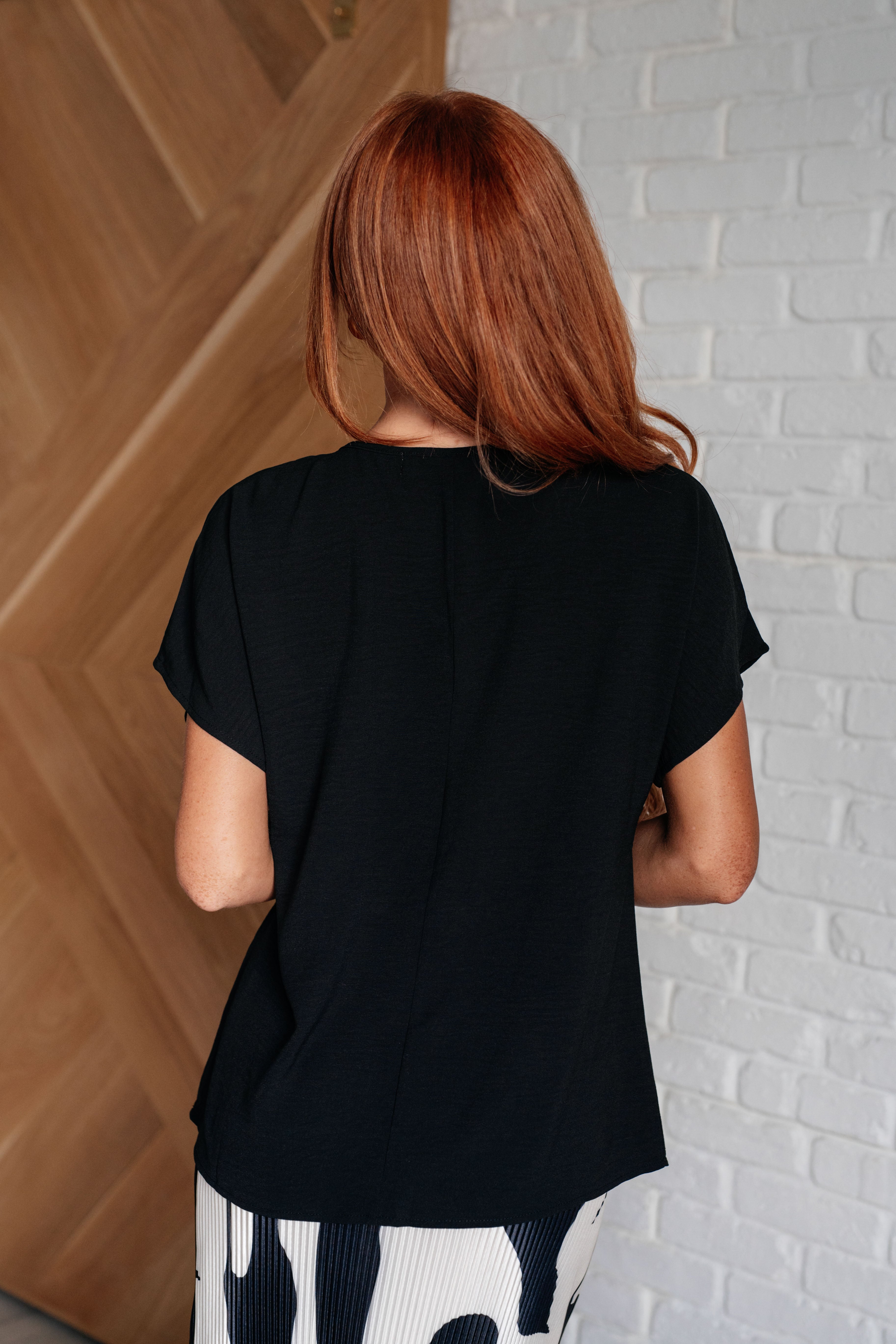 Frequently Asked Questions V-Neck Top in Black Tops Ave Shops- Tilden Co.