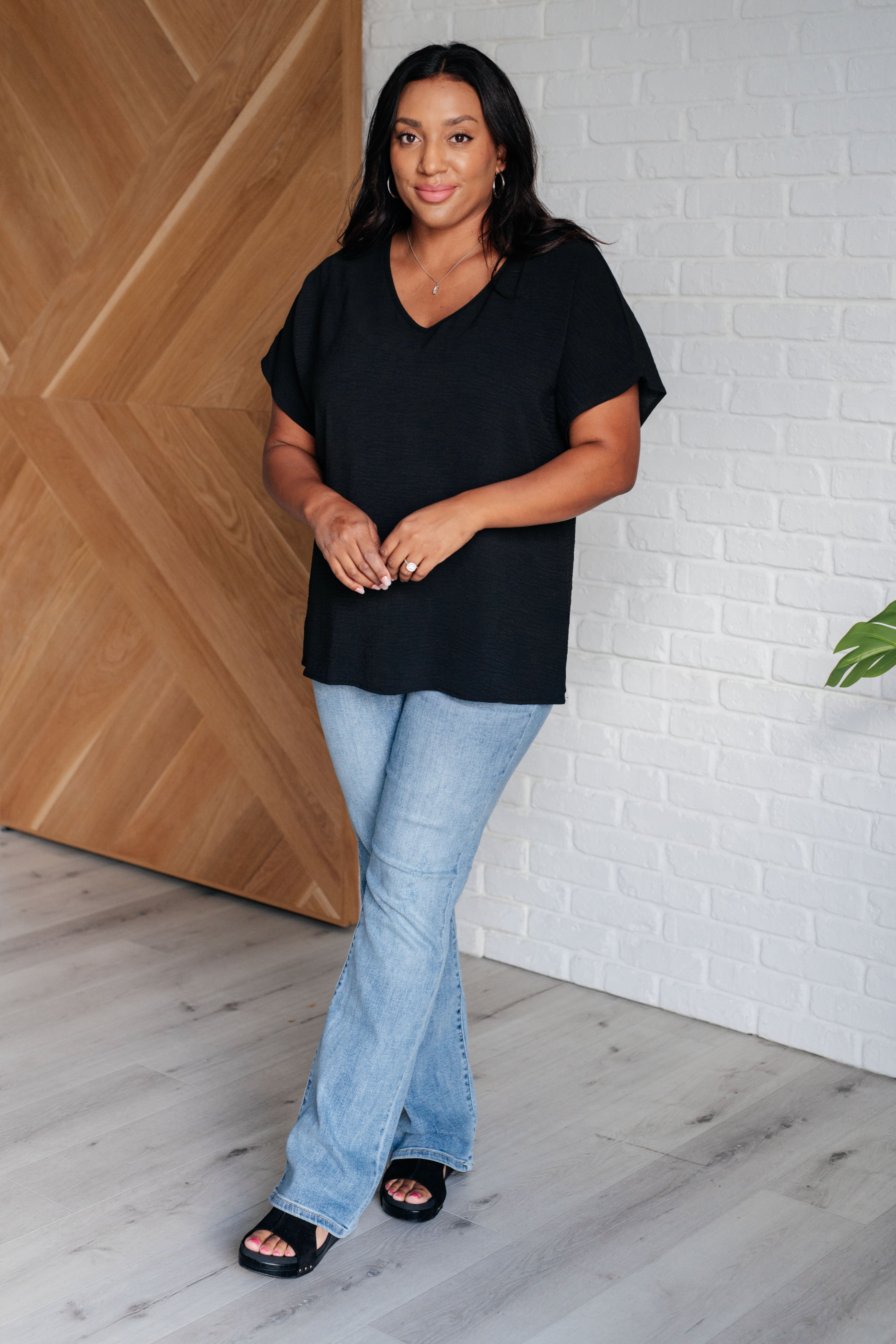 Frequently Asked Questions V-Neck Top in Black Tops Ave Shops- Tilden Co.