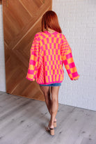 Noticed in Neon Checkered Cardigan in Pink and Orange    Layers Ave Shops- Tilden Co.