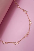 CUTOUT BOW STATION NECKLACE gold gold JOSSLYN by wall to wall- Tilden Co.